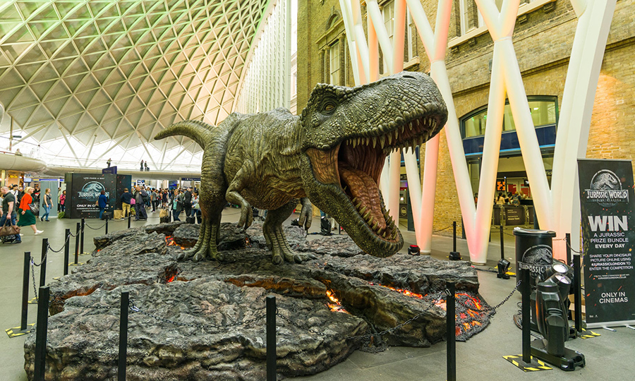 A ‘dinosaur’ promotes the 2015 film Jurassic World, at the Kings Cross station concourse, London. Fiction has fired the imagination, leading to a new wave of research.  Photograph: RZUK Images/Alamy Stock Photo