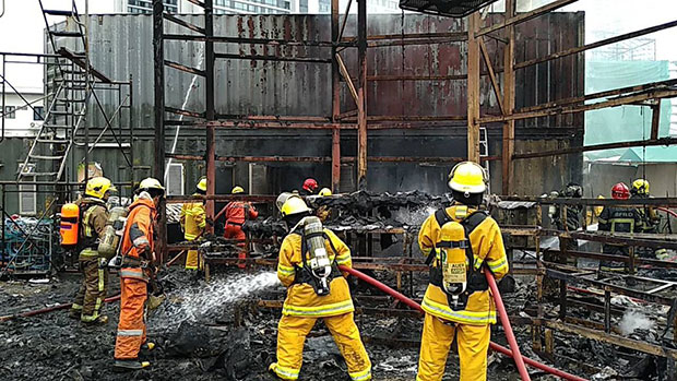  Firefighters douse down the embers after extinguishing the blaze at Dinosaur Planet on Friday afternoon. (Photo from @fm91trafficpro Twitter account)