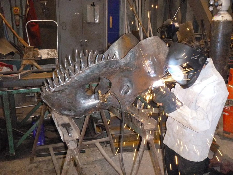 Jaw-dropping: William works on the allosaurus’s head