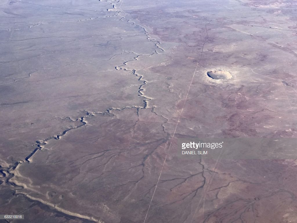 The Meteor Crater near Winslow, Arizona, is seen from a plane January 30, 2017. Like Chicxulub, this is the result of an asteroid impact. DANIEL SLIM/AFP/ GETTY IMAGES